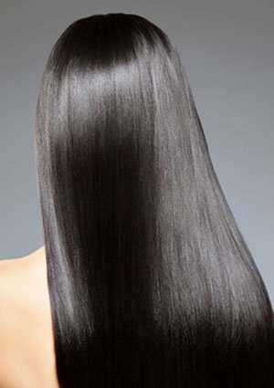 Woman with dark, beautiful hair from Brazilian Keratin treatment